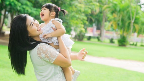 beautiful asian mom and baby playing happiness in the park , outdoor ,mother day concept