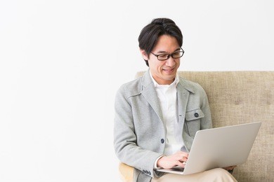 asian middle age man who uses laptop