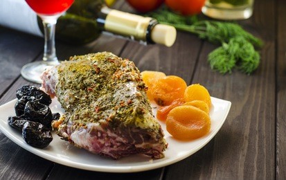 meat with dried apricots and prunes in the wine for baking in the oven