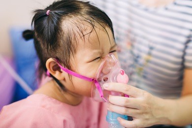 doctor treatment a child who got sick by a chest infection after a cold or the flu that has trouble breathing and prolonged cough. a symptom of asthma or pneumonia.