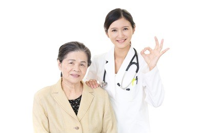 a friendly female doctor and an elderly woman