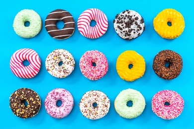 colorful donuts border background, flat lay top view