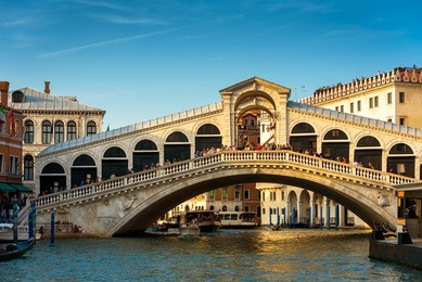 rialto bridge over the grand canal in venice, italy. rialto bridge (ponte di rialto) is one of main travel attractions of venice. historical architecture and landscape of venice. travel across venice.