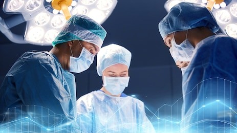 surgery, medicine and people concept - group of surgeons at operation in operating room at hospital