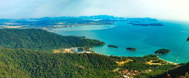panoramic view of blue sky, sea and mountain seen from cable car viewpoint, langkawi island, malaysia. picturesque landscape with tropical forest, beaches, small islands in waters of strait of malacca