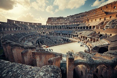 inside colosseum view at sunset, the world known landmark and the symbol of rome, italy.