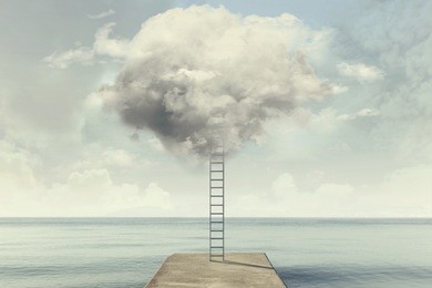 surreal ladder rises up into the sky in a silent sea landscape