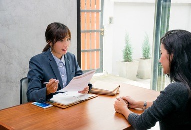 the recruiter is interviewing the candidate and talking about work contract