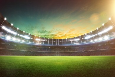 empty night grand stadium with sport light , evening or night scene .