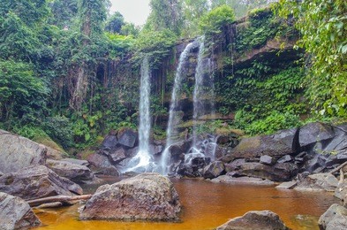 waterfall on the siem reap river. phnom kulen - the sacred mountain in cambodia, the top of the mountain is the sacred place for hindus and buddhists. cambodia, near angkor, phnom kulen national park