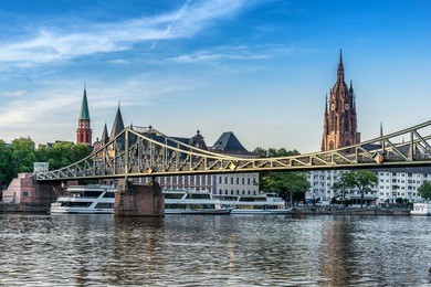 looking across to the eiserner steg bridge and cathedral in frankfurt am main