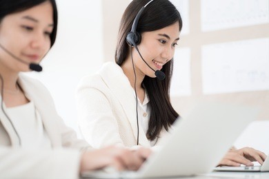 asian young woman working in call centre