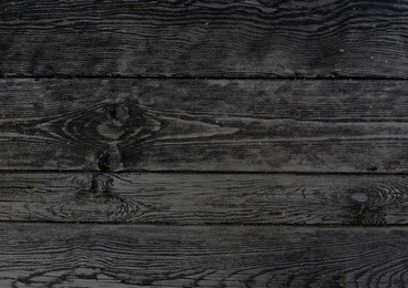 dark wooden boards, planks. naturally aged wood, natural brushing process. the top view. close-up. the stock photos.