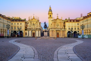 piazza san carlo square and twin churches of santa cristina and san carlo borromeo in the old town center of turin, italy, on sunrise