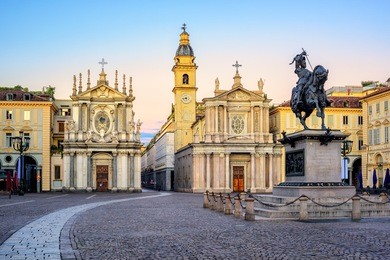 piazza san carlo square and twin churches of santa cristina and san carlo borromeo in the old town center of turin, italy, on sunrise