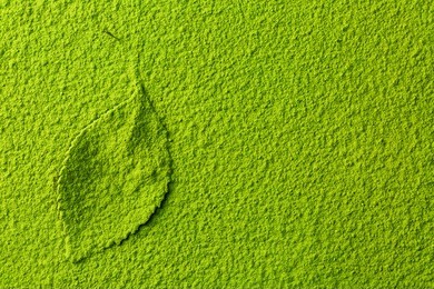 green matcha tea powder background with tea leaf, top view from above