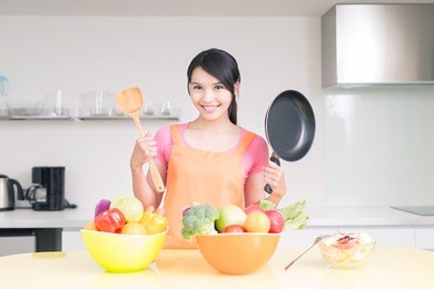 beauty housewife smile happily  in the kitchen