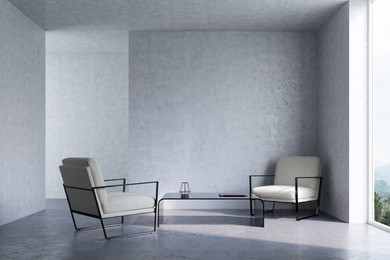 concrete living room interior with a concrete floor and walls, loft windows and two white armchairs with a coffee table standing between them. 3d rendering mock up