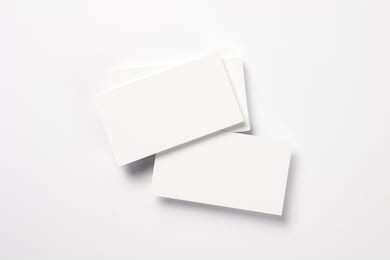 blank business cards isolated on white, studio shot
