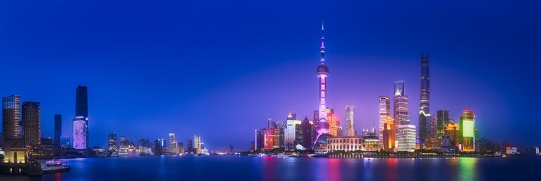 beautiful chinese cityscape of shanghai's skyline with the city lights and tower on the huangpu river bay, shanghai, china.