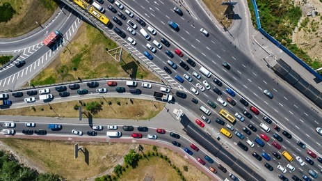 aerial top view of road junction from above, automobile traffic and jam of many cars, transportation concept
