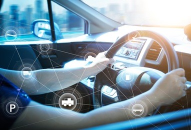 woman driver using smart self-driving car  control system on a hand phone. futuristic driving technology concept .