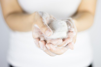 washing of hands with soap under running water.cleaning hands.asian young woman is washing hands with soap 