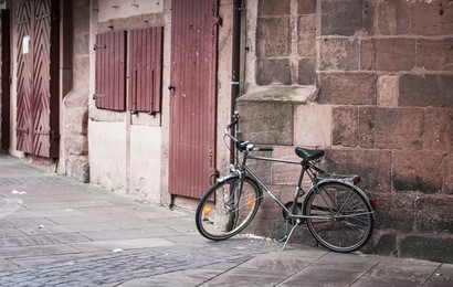 vintage bike parked on the street in old town