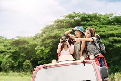 happy asian women friends backpacker enjoy nature during vacation travel trip in forest.