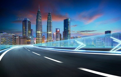 speedy motion forward flyover with beautiful kuala lumpur city skyline , twilight scene .