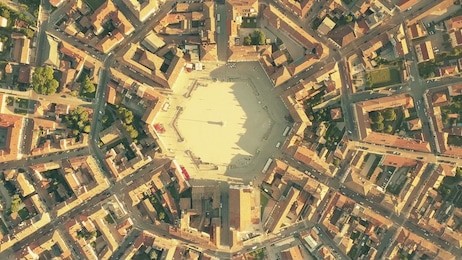 aerial top down view of tiled roofs of symmetric palmanova town, italy
