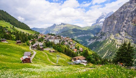 beautiful landscape view of charming murren mountain village with lauterbrunnen valley and swiss alps in background, jungfrau region, bernese oberland, switzerland, europe
