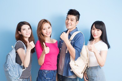 happy group student show thumb up on the blue background