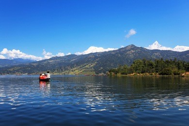 beautiful green hills landscape from boat view on phewa lake, pokhara, nepal
