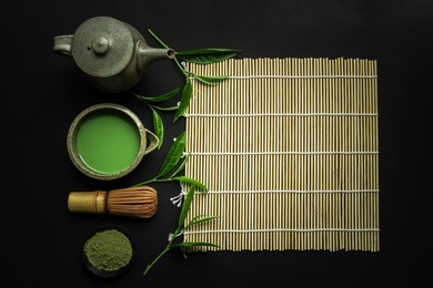 matcha green tea in a bowl and bamboo whisk isolated matcha is a powder of green tea leaves packed with antioxidants on black background.