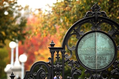 the entrance gate to boston public garden (public space is boston), the sing is the official seal of boston (public domain, first published before 1923).  (public parks, no need for property release)
