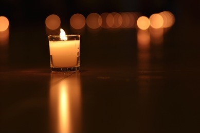 glass candle with it's reflection