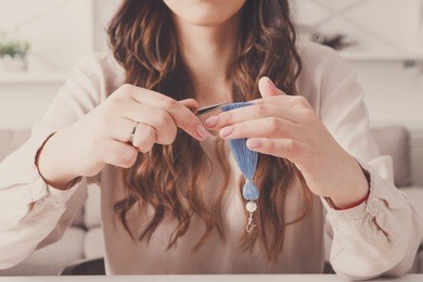 handmade earrings making, home workshop. woman artisan create tassel jewelry. art, hobby, handicraft concept