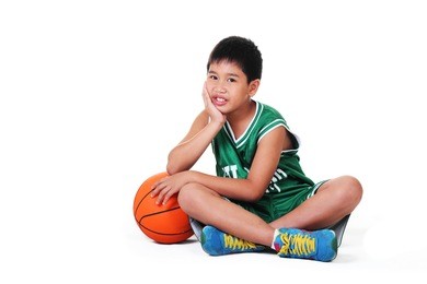 cute boy sitting and relaxing on the floor.white background.