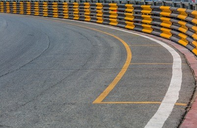 motor racing track. turning asphalt road with marking lines.
