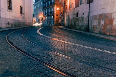 old european city street at night, lisbon, portugal