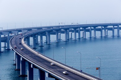 china dalian, across the sea xinghai bay bridge, rainy weather, blue tones