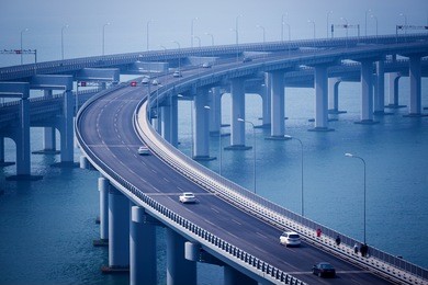 china dalian, across the sea xinghai bay bridge, rainy weather, blue tones
