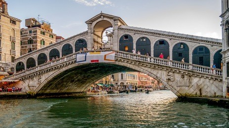 the rialto bridge is  the oldest bridge across the grand canal, and was the dividing line for the districts of san marco and san polo.
