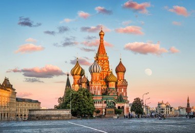 the last rays of the summer sun illuminate st. basil's cathedral on red square in moscow
