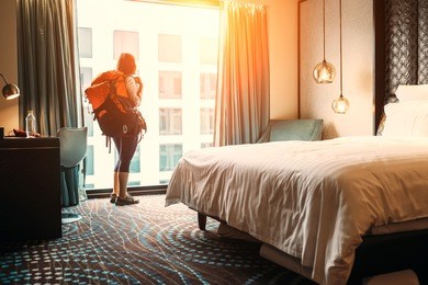 woman backpacker traveler stay in high quality hotel room