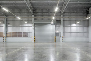 shutter door or roller door and concrete floor inside factory building for industry background.