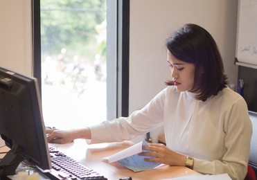 asian business woman using computer with doing finance at the office.finance and accounting concept.