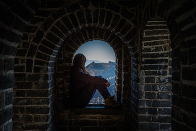 tourist girl at a tower of the great wall of china. the great wall of china is the world's longest wall and biggest ancient architecture