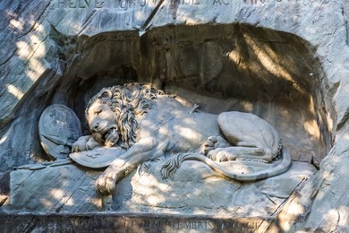 dying lion monument in lucerne in a beautiful summer day, switzerland